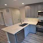Roomy kitchen with wood floor and new appliances: image 6 0f 11