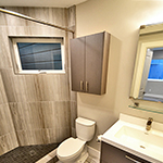 First floor bathroom with wood-colored tiles: image 7 0f 11